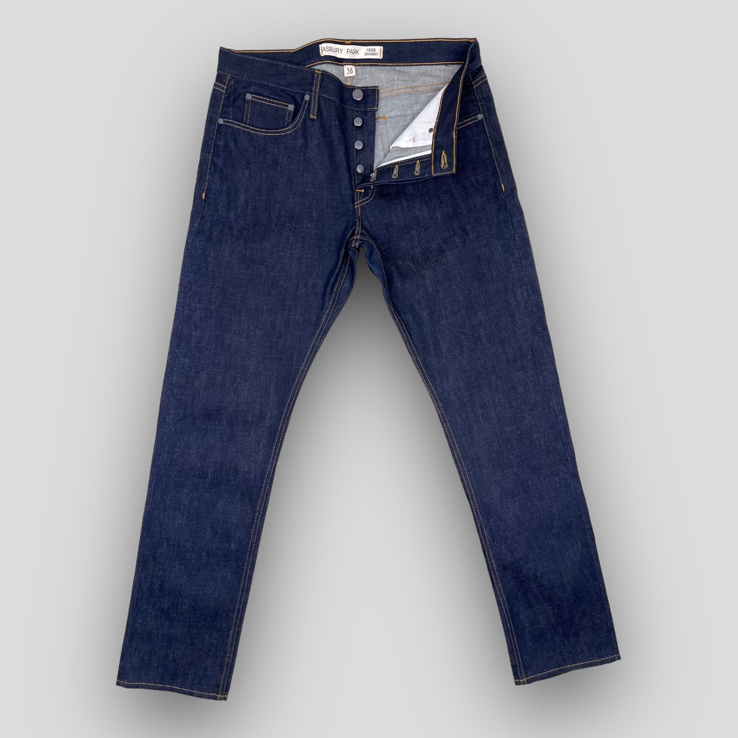 MID-RISE SKINNY FIT IN RAW SELVEDGE